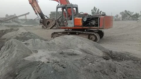 Heavy Duty Construction Machinery at Mining and Stone Crushing Facility Stock Photos