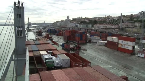Heavy duty container handler moving shipping containers in harbor  Video stock 57046480