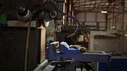 Heavy Duty Milling Machine with Blue Vise Standing in Metal Workshop Stock Footage 342511411