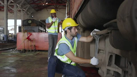 The heavy duty technicians working in the train garage  스톡 동영상 237297614