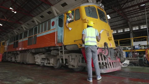 The heavy duty technicians working in the train garage  스톡 동영상 237299259