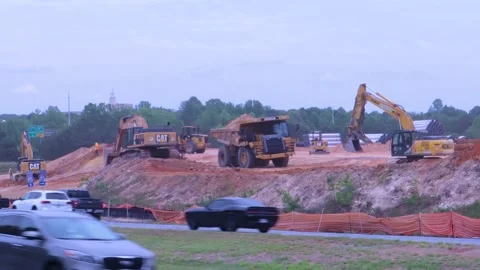 Heavy earth moving trucks at a construction site Stock Footage 143511935