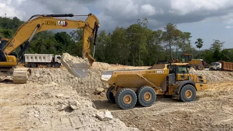 Heavy equipment construction activity after land clearing Stock-Footage 274288398