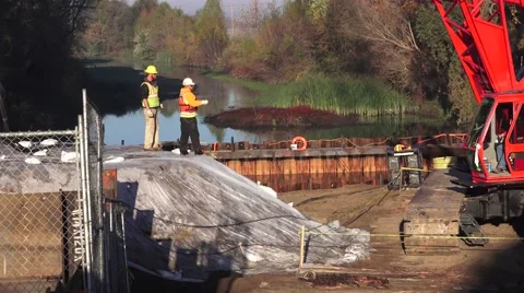 Heavy Equipment Construction, worker sliding Stock Footage 44344366