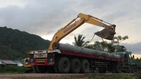 Heavy equipment cranes doing earthworks or earth nails in building construction Stock Footage 247201871