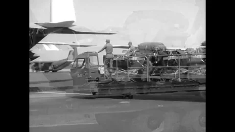 The heavy equipment that the Parachute Rigging students rigged is dropped at the Stock Footage 79423955