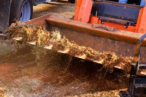 Heavy equipment working on landscaping project in an outdoor setting Stock Photos