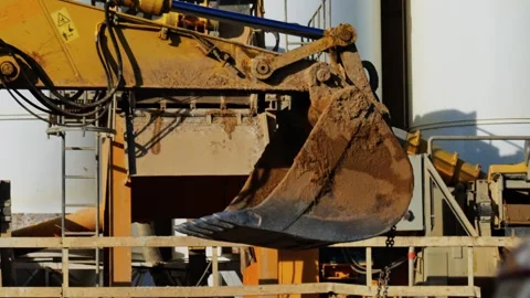 Heavy excavator digging machine bucket filled with dirt moving during const.. Stock Footage 339450152