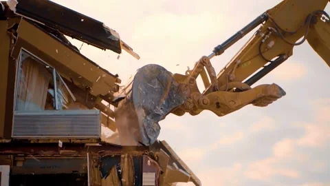 The Heavy Excavator is engaged in Dismantling a Complex Structure, showcasing Stock Footage 312172440