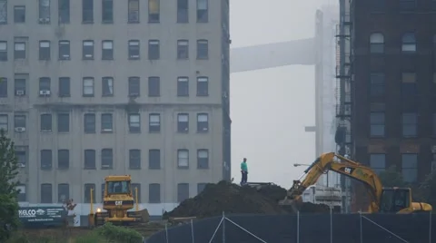 Heavy excavator picking up mud at construction site Stock Footage 61132715
