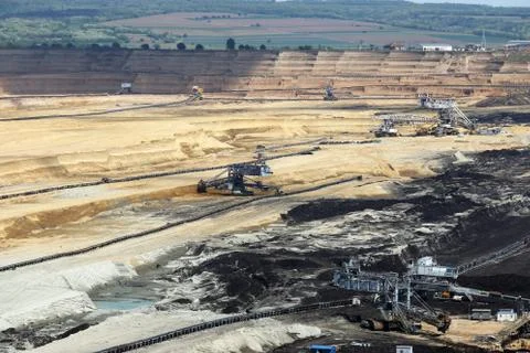 Heavy excavators working on open pit coal mine Fotos de archivo