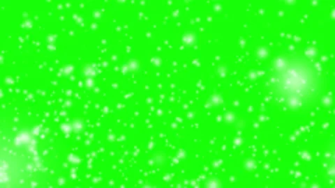 Heavy fast snowfall on green background. Closeup to falling snowflakes on green Stock Footage 321836023