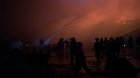 Heavy fire in plastic storage warehouse Stock Footage 290944411