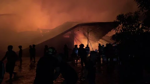 Heavy fire in plastic storage warehouse Stock Footage 290944413