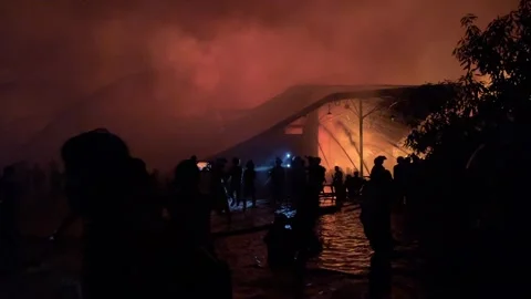 Heavy fire in plastic storage warehouse Stock Footage 290944522