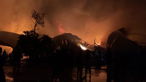 Heavy fire in plastic storage warehouse Stock Footage 290944633