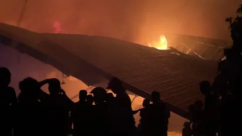 Heavy fire in plastic storage warehouse Stock Footage 290944634