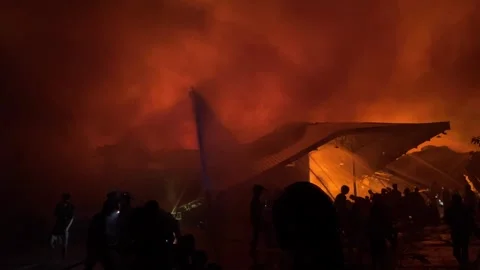 Heavy fire in plastic storage warehouse Stock Footage 290944913