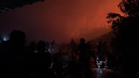 Heavy fire in plastic storage warehouse Stock Footage 290944990