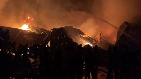 Heavy fire in plastic storage warehouse Stock Footage 290944991