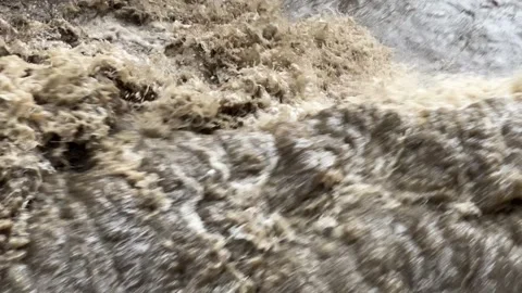 Heavy flow of rainwater in the river Stock Footage 307841381