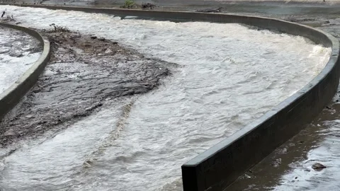 Heavy flow of rainwater in the river 스톡 동영상 307844763