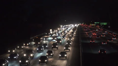 Heavy freeway traffic at nigh Stock Footage 137481811