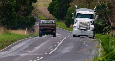 Heavy good truck diving on appalling road in Corangamite Shire. 스톡 동영상 87849979