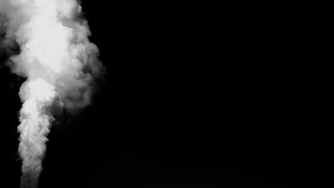 Heavy gray smoke streaming from down to up on the left side on black background Video stock 109428230