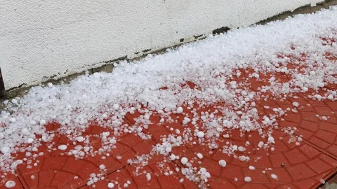 Heavy hail and rainfall, hail grains falling on the ground, Stock Footage 89864281