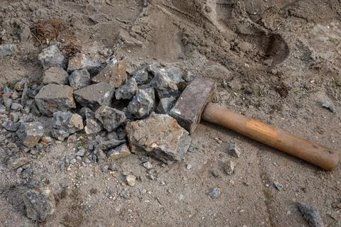 A heavy hammer lying on the ground Stock Photos