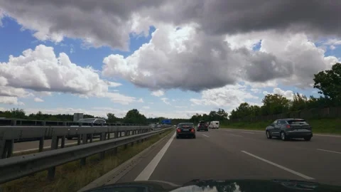 Heavy highway traffic jam and electronic warning signs on German Autobahn A8 in 스톡 동영상 346495905