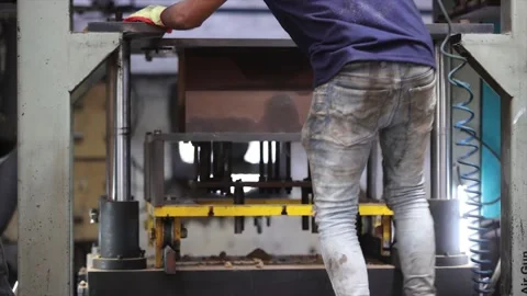 A heavy hydraulic molding machine shaping of a sand mold used for metal casting Stock Footage 321338587
