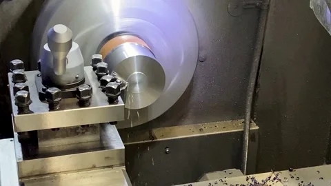 Heavy industrial worker performs a mechanical operation on a machine for the  Vidéo 195953891