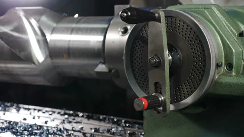 Heavy industry concept. Close-up shot of steel detail rotating while processing Stock Footage 128572920