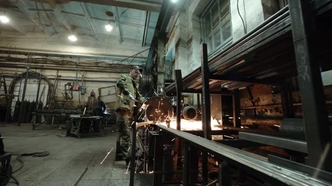 Heavy Industry Engineering Factory Interior with Industrial Worker Using Angle Stock Footage 178852224