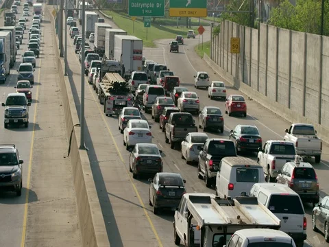 Heavy interstate traffic pan Baton Rouge interstate 10 i10 commuter congestion Stock Footage 74906989