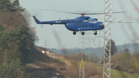 Heavy Lift Helicopter Operating Beside Transmission Tower Stock-Footage 346305553