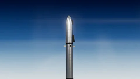 Heavy lift rocket ascending through sunlit cloud layers with engine glow below Stock Footage 339882307