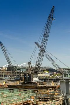  Heavy lifting cranes working on a new harbor development  Fotos de archivo