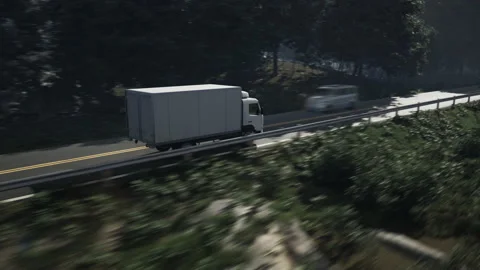 Heavy Load Shipment Moved By Van Vehicle Through Road Near Forest Trees Stockbeeldmateriaal 238965932