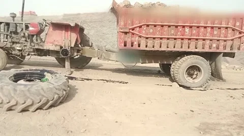 Heavy Loaded Tractor Trolley at Construction and Mining Site, Stock Footage 338030413