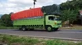 Heavy loaded truck driving slowly uphill mountain serpentines Flores Indonesia 4k or 4k+ Resolution