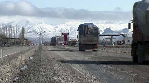 Heavy loaded trucks driving, Eastern Turkey.mp4 Stock Footage 61396724