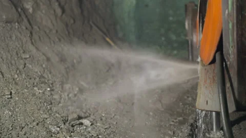 Heavy machine with coolant and robot drill operates in mine Stock Footage 236276662