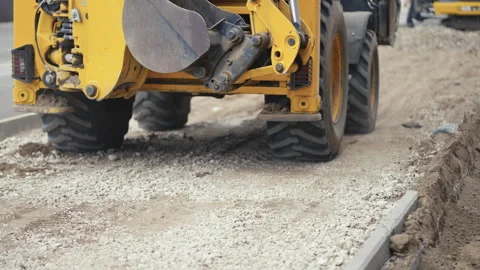 Heavy Machinery is Actively Working on a Major Road Construction Project Near Stock Footage 312698536