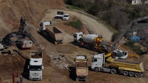 Heavy Machinery and Construction Fleet Operating at Large Build Site Stock Footage 333409178