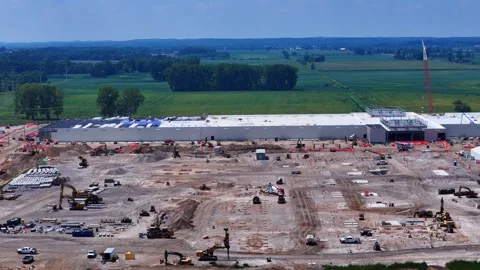 Heavy machinery building a massive data center construction site in Saline Stock Footage 348773238