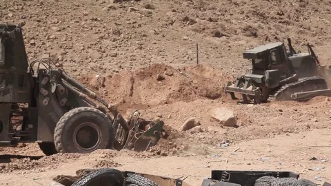 Heavy machinery in excavation at Forward Operating Base Whitehouse - 2012 Stock Footage 104298660
