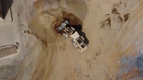 Heavy machinery front loader moving sand at construction site Stock Footage 337673969